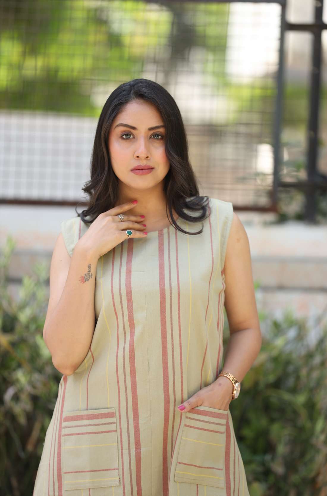 Sleeveless beige striped A-line kurti β front view