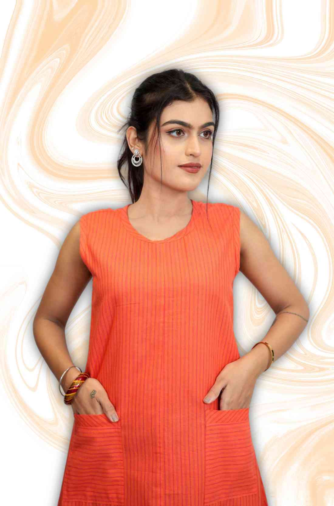 Close-up of pocket on sleeveless orange kurti