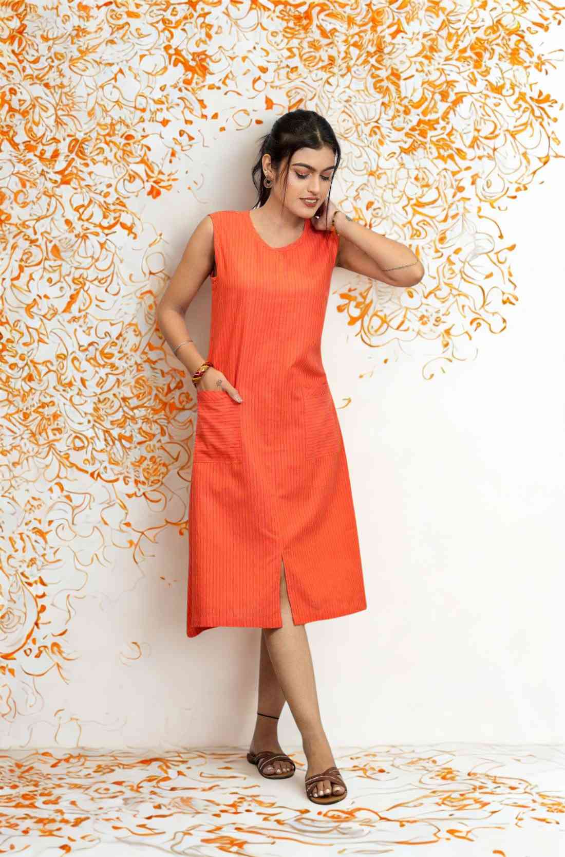 Lifestyle pose in sleeveless orange cotton kurti