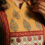 micro close up view of the yoke of the dark kurta 