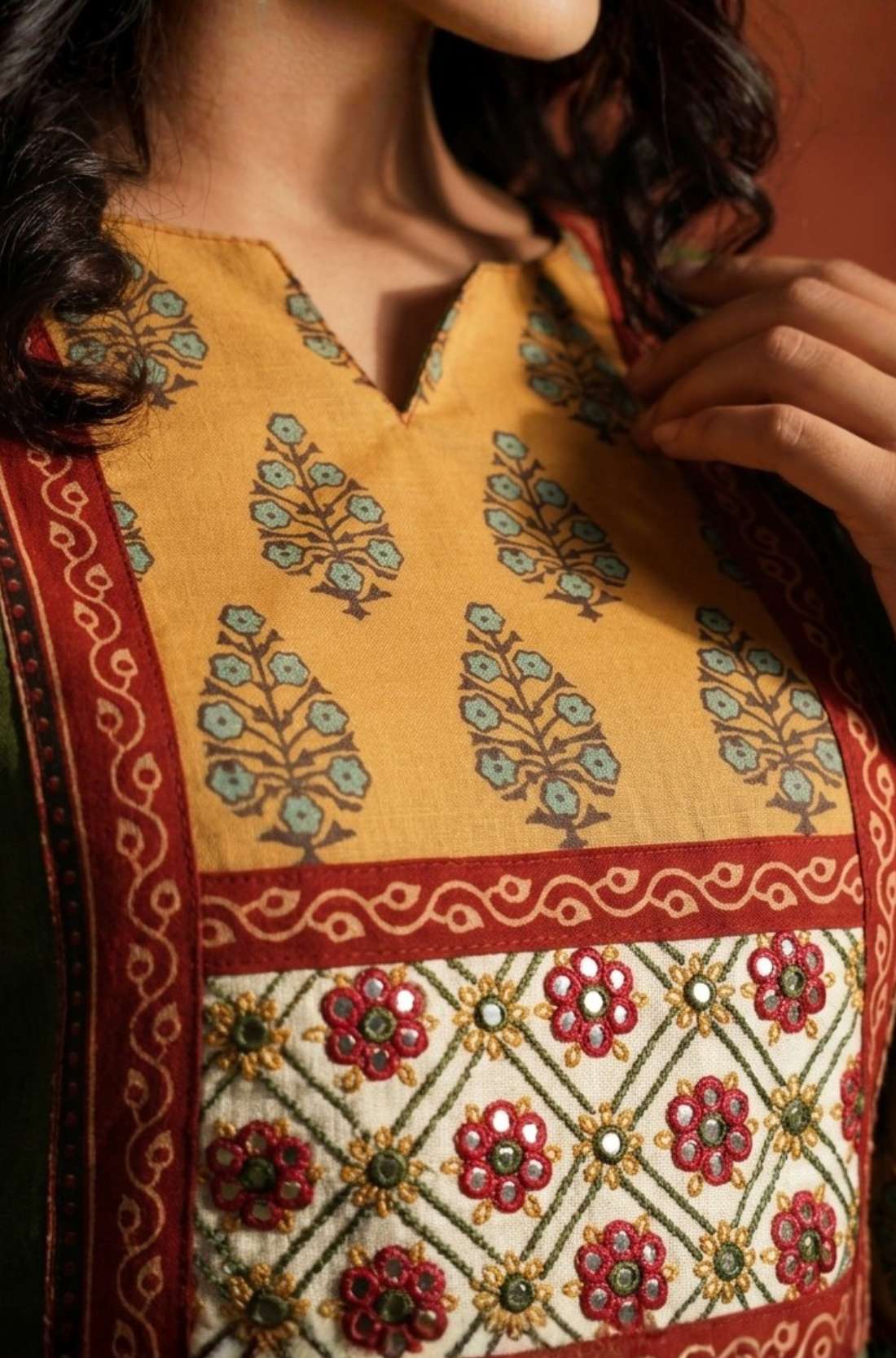 micro close up view of the yoke of the dark kurta 