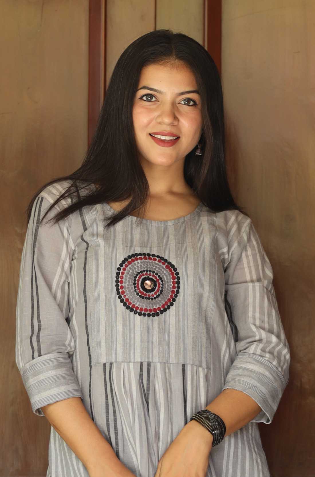 Grey a line kurta with circle embroidery on the yoke also known as striped kurta for women.