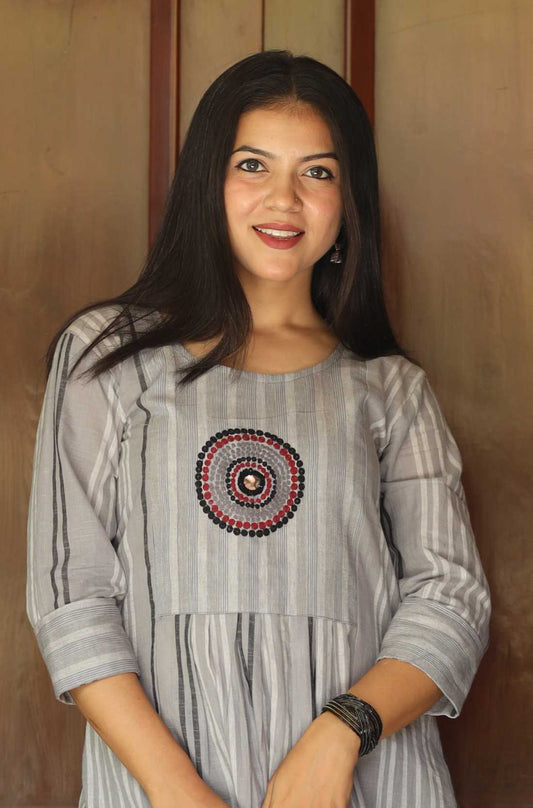 Grey a line kurta with circle embroidery on the yoke also known as striped kurta for women.