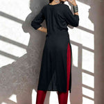 Black hand embroidery and block print a line kurti view from the back.