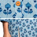 Detailed view of powder blue pure cotton short kurti highlighting handcrafted floral block print, wooden button closure and side slit for ease of movement.