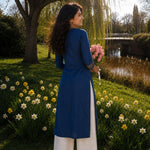 Back view of an indigo pure cotton straight-fit kurta with three-quarter sleeves and side slits.