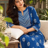 Sitting pose of the round neckline with contrast diagonal striped yoke, red piping, and white floral hand block print detailing on an indigo pure cotton kurta
