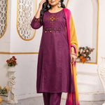 Model wearing a magenta pure cotton kurta pant set featuring multicolour geometric cross-stitch embroidery with mirror detailing, three-quarter sleeves, straight-fit pants and an ombre tie-dye chiffon dupatta.