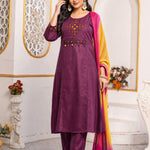 Model wearing a magenta pure cotton kurta pant set featuring multicolour geometric cross-stitch embroidery with mirror detailing, three-quarter sleeves, straight-fit pants and an ombre tie-dye chiffon dupatta.