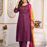 Model wearing a magenta pure cotton kurta pant set featuring multicolour geometric cross-stitch embroidery with mirror detailing, three-quarter sleeves, straight-fit pants and an ombre tie-dye chiffon dupatta.