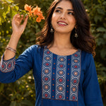 Close-up of the hand block printed yoke with decorative mirror work on an indigo pure cotton kurta.