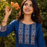 Close-up of the hand block printed yoke with decorative mirror work on an indigo pure cotton kurta.