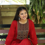 Sitting_pose_in_maroon_embroidered_A-line_kurta