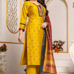Full-length view of a mustard yellow Vichitra silk kurta set with embroidered kurta, straight-fit pants, three-quarter sleeves, mirror-work neckline, and contrasting printed Chanderi silk dupatta, styled for festive wear.
