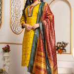 Model wearing a mustard yellow Vichitra silk kurta set featuring a mirror-work V-neckline, contrast Bandhani-print panel, sequin and thread embroidery, straight pants, and a printed Chanderi silk dupatta.