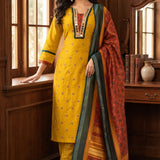 Model wearing a mustard yellow Vichitra silk kurta set featuring a mirror-work V-neckline, contrast Bandhani-print panel, sequin and thread embroidery, straight pants, and a printed Chanderi silk dupatta.