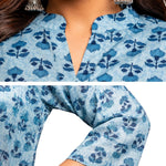 Close-up of powder blue pure cotton hand block printed short kurti featuring mandarin notch neckline, wooden buttons, floral block print and 3/4 sleeves.
