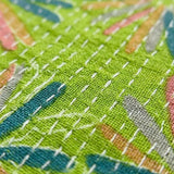 Macro view of the breathable pure cotton fabric featuring colourful Jaipur floral print and traditional white Kantha stitch detailing.
