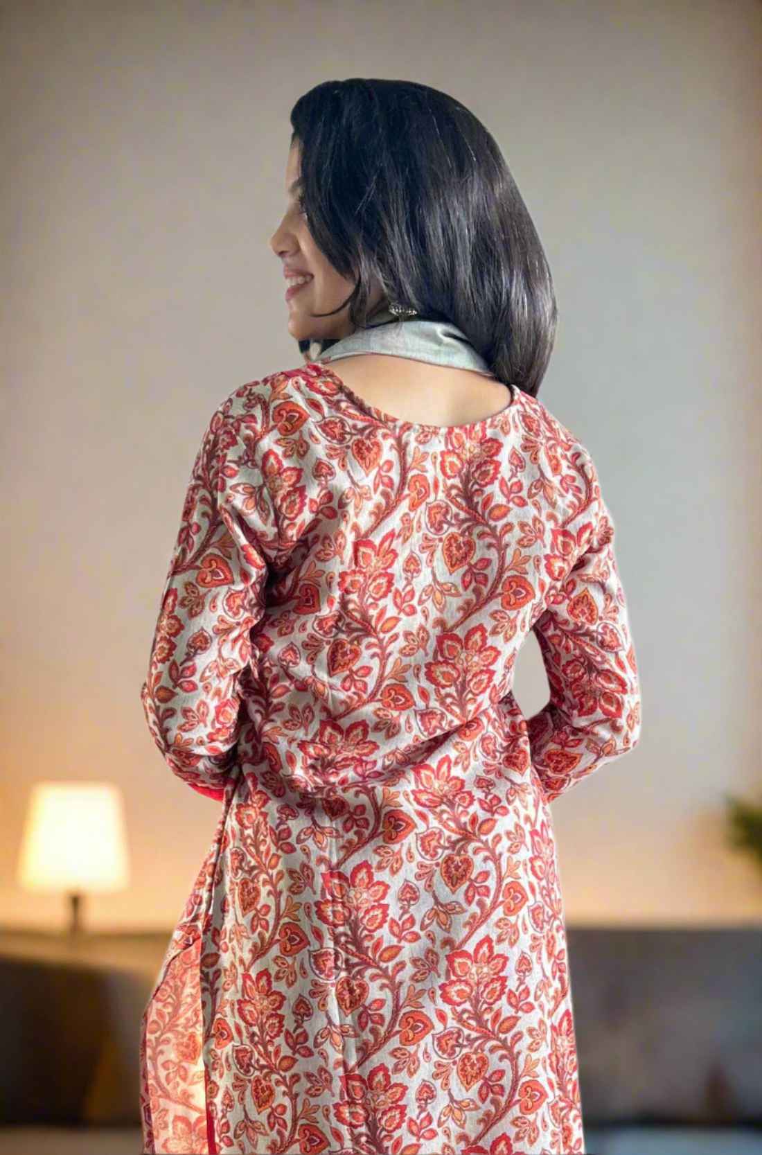 Back view of red pashmina kurta set fom the back.