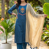 Front view of a women's royal blue straight-fit crepe kurta set with decorative floral yoke, matching trousers and gold dupatta.
