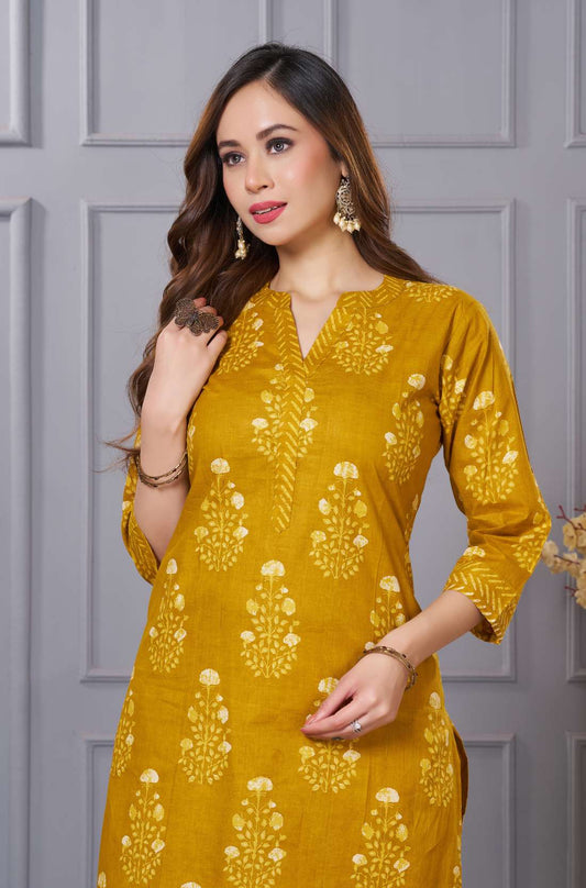 A close-up view of the teal kurta - highlighting the vibrant traditional paisley embroidery on the chest - and the subtle sheen of the fabric.