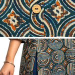 Close-up detail of Women's Geometric Hand Block Print Pure Cotton Shirt Style Kurti in Bottle Green and Rust featuring handcrafted geometric block print, wooden button placket, premium pure cotton fabric, and side slit for comfortable everyday wear.