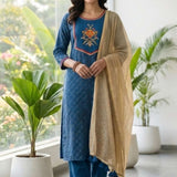 Full-length indoor view of the royal blue crepe kurta set with matching trousers and gold tassel dupatta.