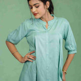 Half-length front view of women's sea green rayon Top featuring a mandarin collar, button-down front, subtle pleats, and relaxed fit for office and casual styling.