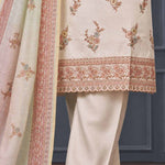 Close-up of floral embroidery and decorative scalloped border on a beige silk blend kurta for women.