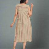 Back view of sleeveless beige striped A-line kurti