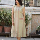 Model walking in sleeveless beige striped A-line kurti