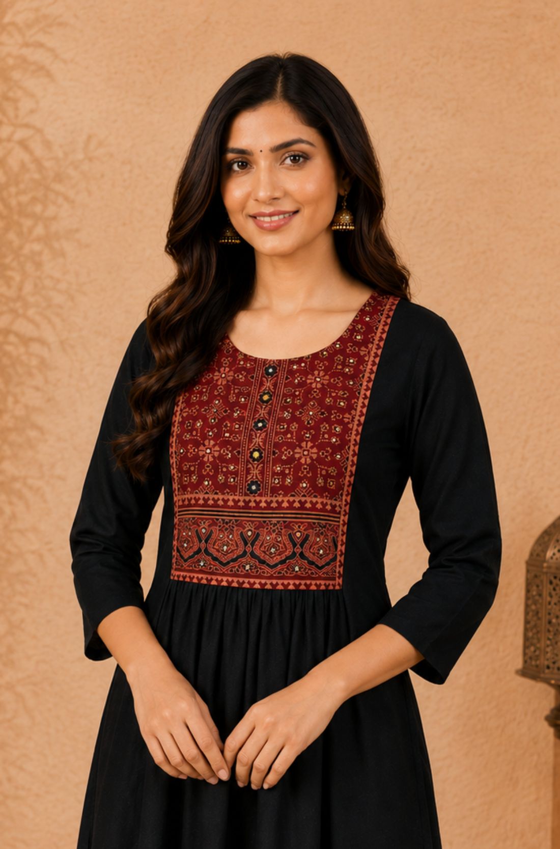 Close-up of black rayon kurta with hand embroidery, block print and mirror work on the front yoke