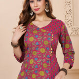 Close up view of the elegant V neckline design showcasing white lace inserts and border trims on a bright pink cotton floral print kurta