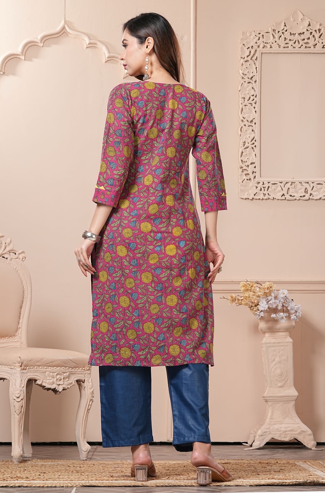 Back view of the straight fit bright pink cotton floral kurta set showcasing the clean layout and print continuation on the back