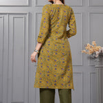Back view of the sage green straight fit cotton floral kurta set highlighting the clean print alignment and fluid dupatta drape