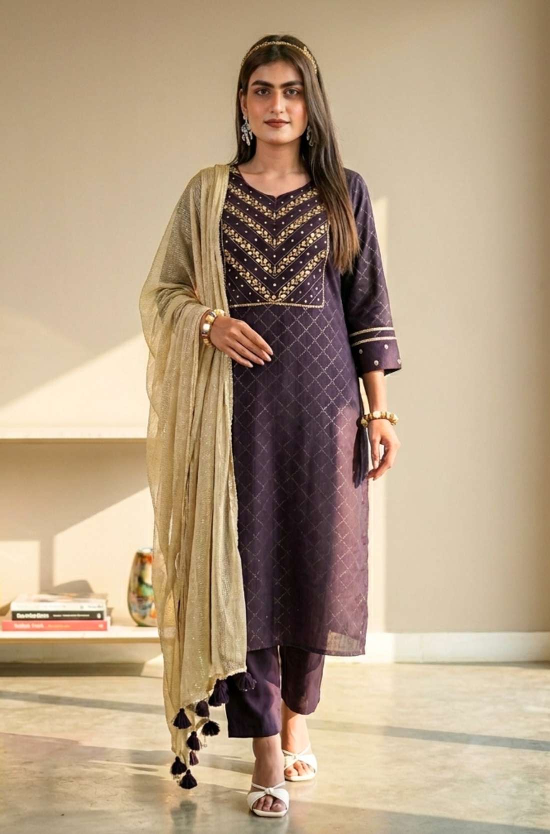 Front full length view of a model in a luxury dark purple crepe hand embroidered suit set with matching pants and an elegant printed dupatta