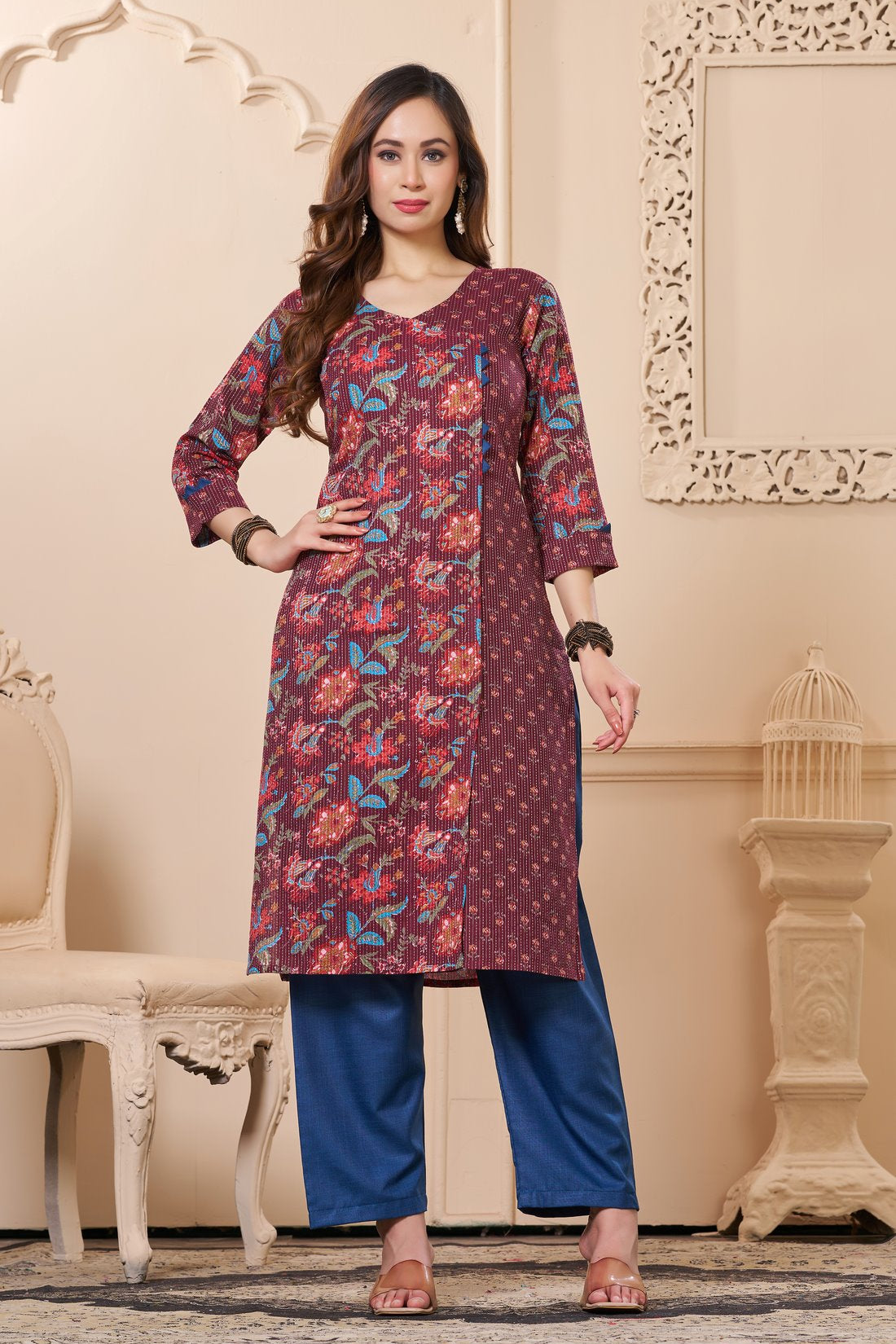Front full length view of a model wearing a deep mudberry purple cotton floral print kurta set with matching pocketed straight pants and a coordinating printed dupatta