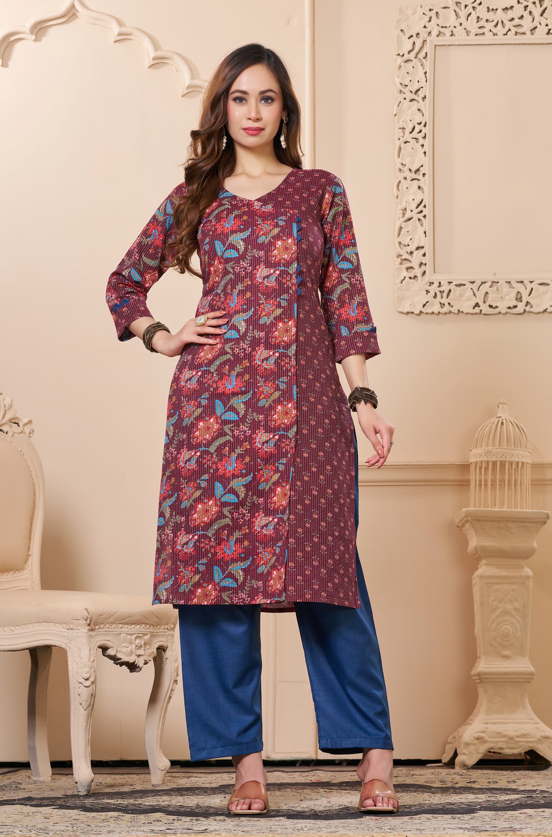 Front full length view of a model wearing a deep mudberry purple cotton floral print kurta set with matching pocketed straight pants and a coordinating printed dupatta
