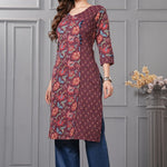 Side profile view of a model in a deep mudberry purple floral printed cotton ethnic suit showcasing the regular fit and elegant dupatta drape