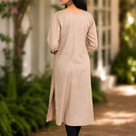Back view of beige A-line rayon kurta with 3/4 sleeves and straight back fall