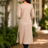 Back view of beige A-line rayon kurta with 3/4 sleeves and straight back fall