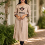 Embroidered beige A-line rayon kurta with cross stitch yoke and 3/4 sleeves, front view