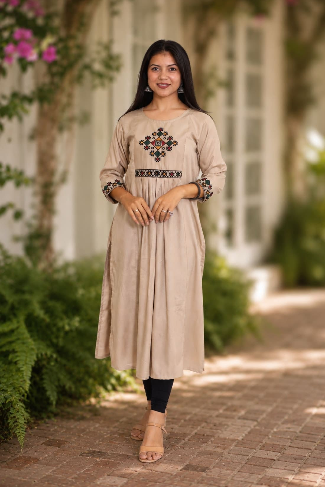 Embroidered beige A-line rayon kurta with cross stitch yoke and 3/4 sleeves, front view