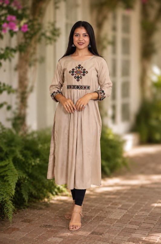 Embroidered beige A-line rayon kurta with cross stitch yoke and 3/4 sleeves, front view