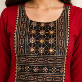 Close-up of hand embroidery, mirror work and block print on maroon rayon kurta for women