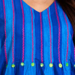 Close-up view of the V-neck and yoke featuring intricate thread embroidery and pintuck detailing on the Philippine Blue handloom cotton midi dress for women.