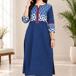 Full-length front view of a woman wearing a blue Indigo pure cotton straight kurti with a printed geometric yoke and red placket detail.