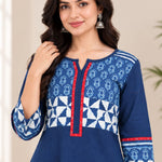 Close-up view highlighting the notch neck design, red trim, and block-printed pattern on the yoke and sleeves of the Indigo cotton kurti.