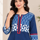 Close-up view highlighting the notch neck design, red trim, and block-printed pattern on the yoke and sleeves of the Indigo cotton kurti.