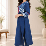 Side view of a model demonstrating the fit, side slit, and three-quarter sleeve details of the blue Indigo cotton kurti.